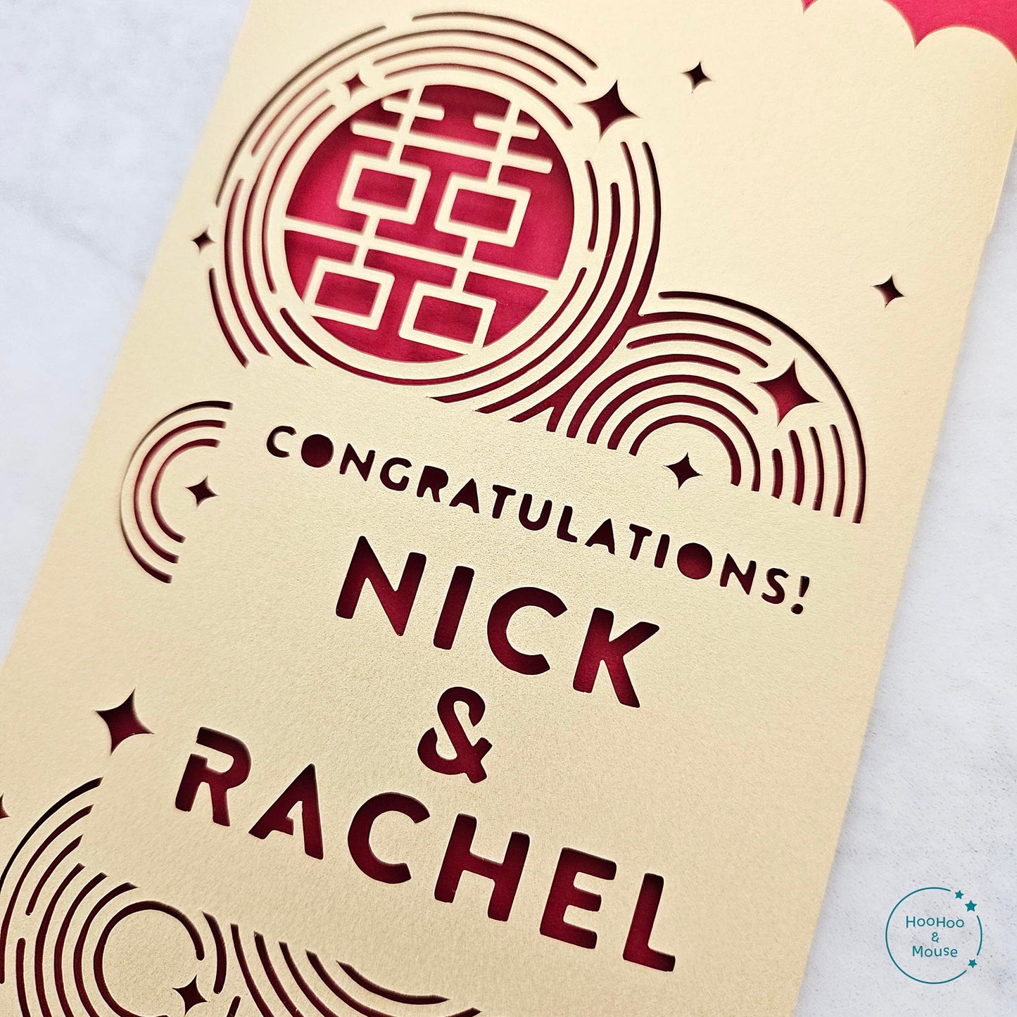 Up close image detailing paper cut details of a red envelope design