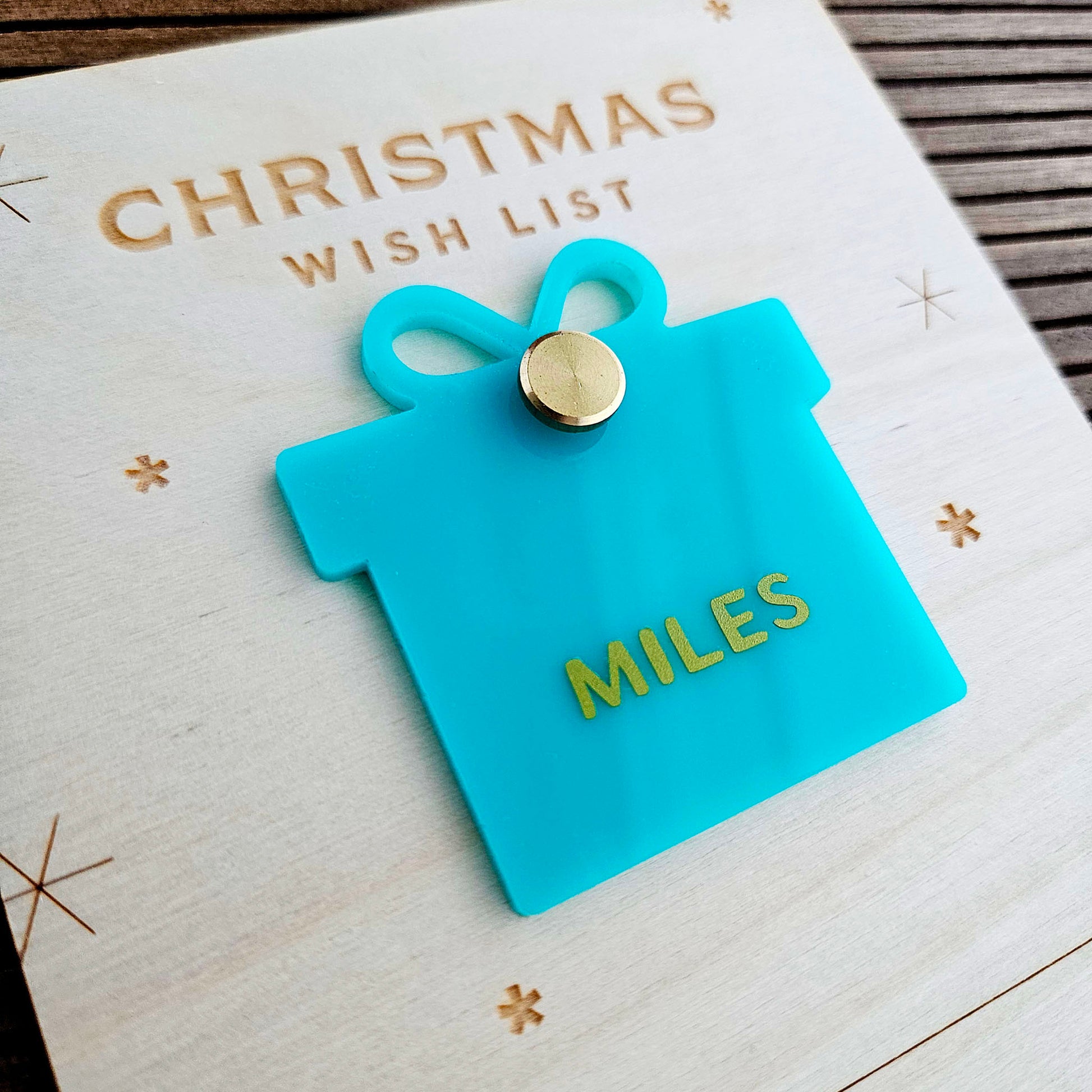 Wooden Christmas list with a personalized present shaped name tag